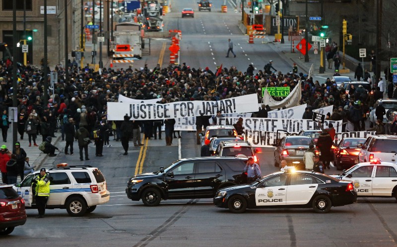Hundreds of Black Lives Matter demonstrators and supporters occupy the street in front of the federal building, CREDIT: AP PHOTO/JIM MONE