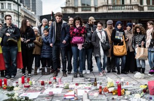 People gather at a memorial for victims of attacks in Brussels on Wednesday, March 23, 2016. CREDIT: (AP Photo/Valentin Bianchi)