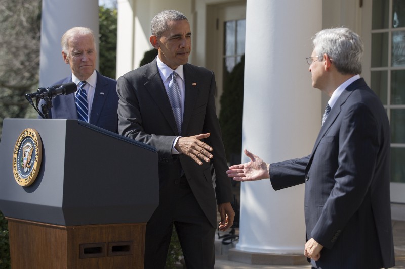 Federal appeals court judge Merrick Garland, right, shakes hands with with President Barack Obama as Vice President Joe Biden looks on as he is introduced as Obamas nominee for the Supreme Court during an announcement in the Rose Garden of the White House, on Wednesday, March 16, 2016, in Washington. CREDIT: AP PHOTO/EVAN VUCCI