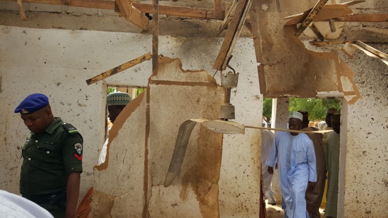 People inspect a damaged mosque following a suicide bomb explosion in Maiduguri, Nigeria Wednesday, March 16, 2016. CREDIT: AP Photo