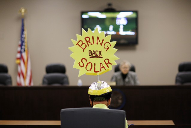 A man speaks at the Public Utilities Commission of Nevada, Friday, Feb. 12, 2016, in Las Vegas. Regulators with the commission are expected to vote Friday on a measure to ease existing solar customers into higher rates at a slower pace than previously approved, although the decision is so fraught that solar proponents have promised a referendum and are demanding a special legislative session. CREDIT: AP Photo/John Locher