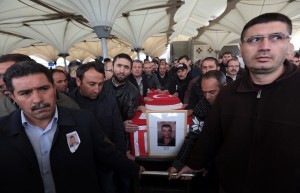 Family members and friends carry the Turkish flag-draped coffin of Murat Gul, 20, a security agent killed in Sunday’s explosion during his funeral procession in Ankara, Turkey, Monday, March 14, 2016. CREDIT: AP Photo/Burhan Ozbilici
