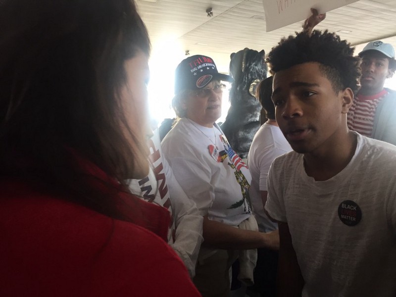 Miles Wilson, 17, is confronted by a Trump supporter outside Trump’s rally in Cleveland, Ohio. CREDIT: Emily Atkin