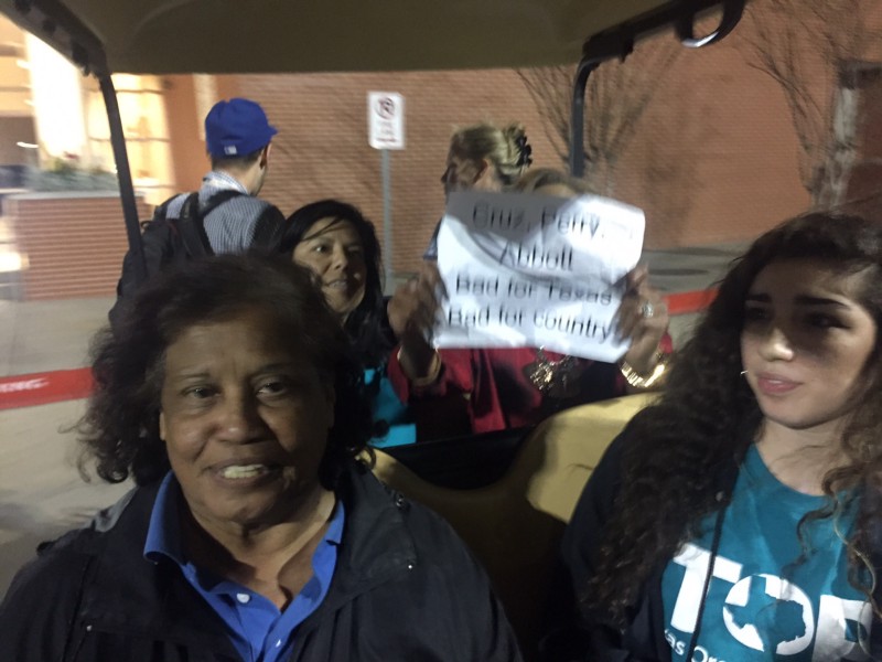 Protestors with the Texas Organizing Project are escorted off the premises after interrupting Sen. Ted Cruz’s rally on Monday night. CREDIT: EMILY ATKIN