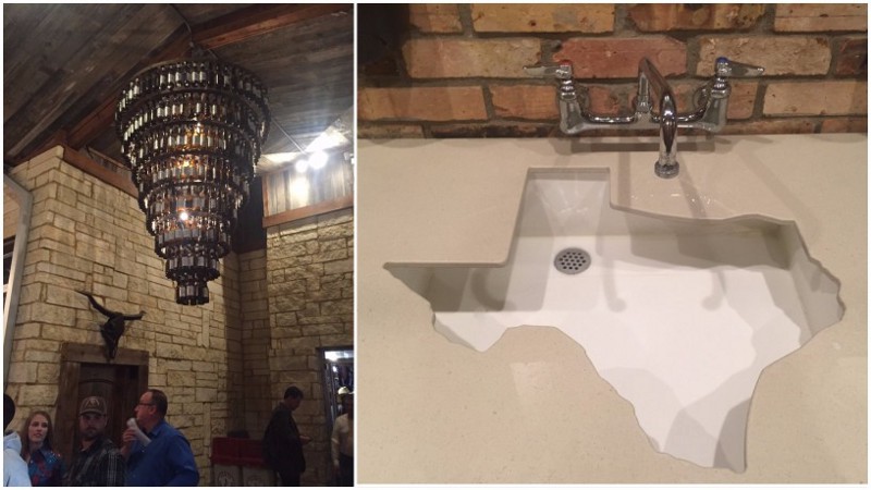 A beer bottle chandelier and Texas-shaped sink at the Redneck Country Club in Stafford, Texas CREDIT: Emily Atkin