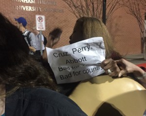 Dorothy Wagner holds up the sign she used to protest Ted Cruz at his rally in Houston on Monday. CREDIT: Emily Atkin