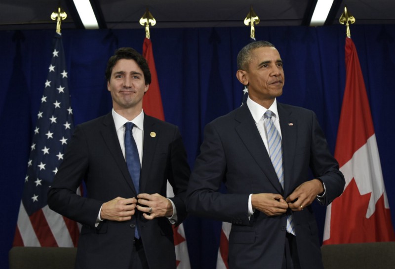 U.S. President Barack Obama, right, and Canada’s Prime Minister Justin Trudeau stand up following their bilateral meeting at the Asia-Pacific Economic Cooperation summit in Manila, Philippines, Thursday, Nov. 19, 2015. CREDIT: AP PHOTO/SUSAN WALSH