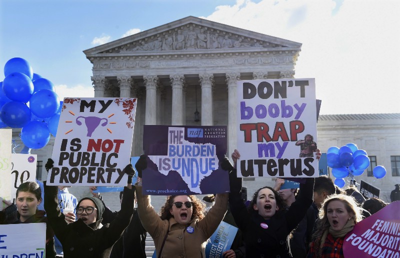 Pro-abortion rights protesters rally outside the Supreme Court in Washington, Wednesday, March 2, 2016. CREDIT: AP PHOTO, SUSAN WALSH