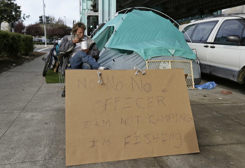 A homeless tent encampment along Division Street in San Francisco, before it was cleared by police and city workers in late February. CREDIT: AP PHOTO/ERIC RISBERG