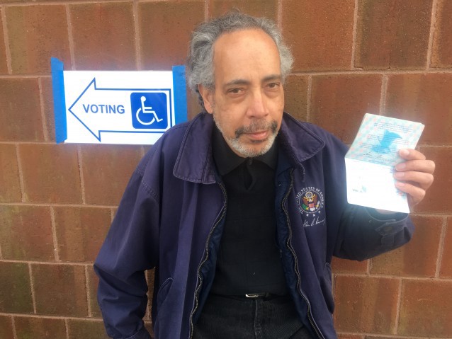 Richmond, Virginia resident Isaac Graves brought his passport to vote. CREDIT: Kira Lerner