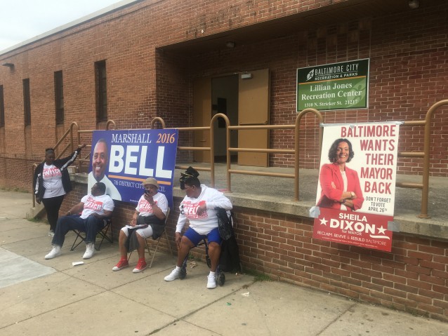 Volunteers sit outside the polling place closest to where Gray was taken into police custody. CREDIT: Kira Lerner