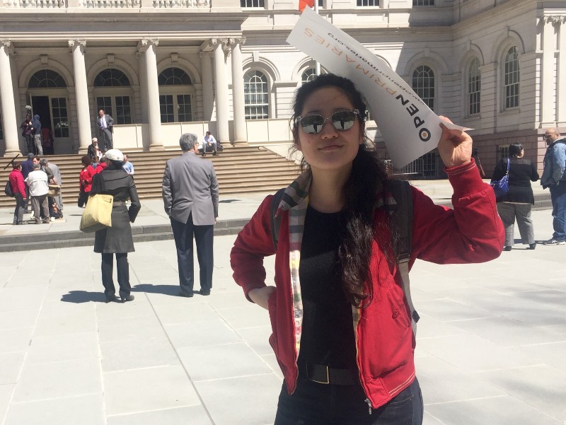 Ssong Young, a Brooklyn resident, said she’s going to get three people to vote for Bernie Sanders since she herself can’t vote. CREDIT: EMILY ATKIN