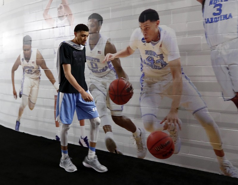 North Carolina’s Justin Jackson walks down to the interview room for a news conference for the NCAA Final Four tournament college basketball championship game Sunday, April 3, 2016, in Houston. CREDIT: ERIC GAY, AP