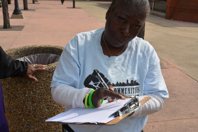 Trina Ashley registers with Communities United before heading to the polls.