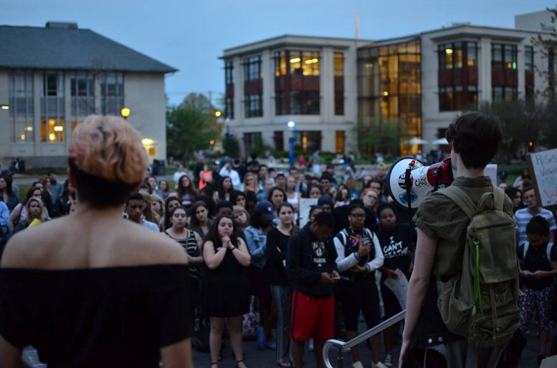 Lane Balassie (right) addresses fellow protesters outside the Mary Graydon Center. CREDIT: BRYAN PARK, THEĀ EAGLE
