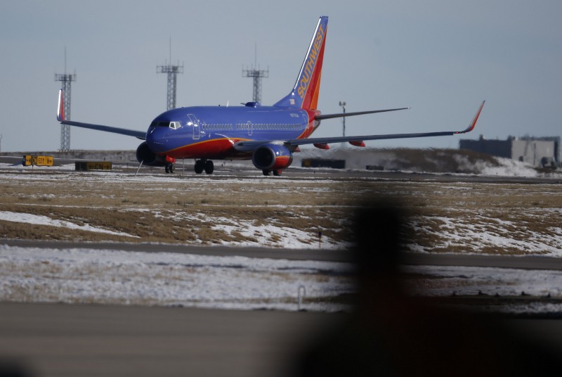 In this photograph taken late Monday, Feb. 8, 2016, a Southwest Airlines plane heads to a runway at Denver International Airport. CREDIT: AP PHOTO/DAVID ZALUBOWSKI