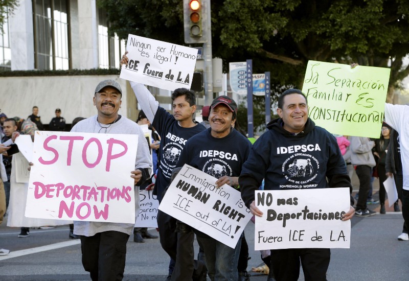 Immigration activists march in a rally against the U.S. Immigration and Customs Enforcement’s (ICE) raids and deportation of immigrants near the downtown Los Angeles Federal Building. CREDIT: AP PHOTO/NICK UT, FILE