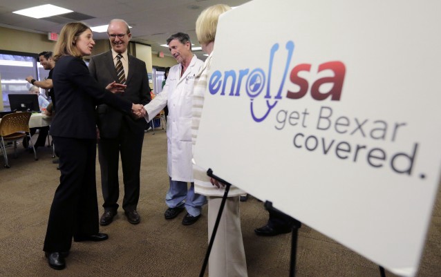 U.S. Department of Health and Human Services Secretary Sylvia M. Burwell, left, greets Dr. Abraham Alecozay as she tours a health insurance enrollment event at Southwest General Hospital in San Antonio. CREDIT: AP Photo/Eric Gay