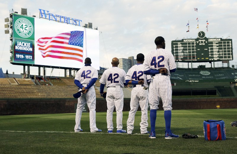 Chicago Cubs players wear No. 42 in recognition of Jackie Robinson Day before a baseball game against the Cincinnati in Chicago, Wednesday, April 15, 2015. CREDIT: NAM Y. HUH, AP