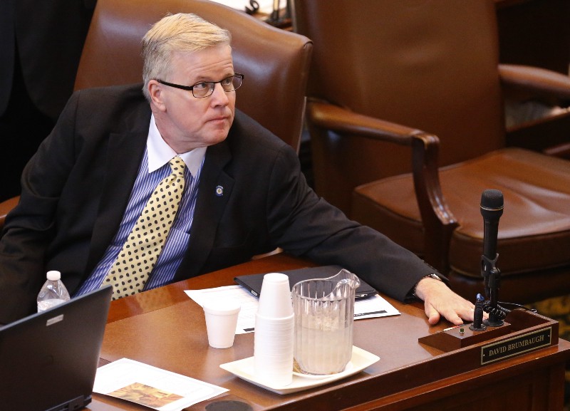 Oklahoma state Rep. David Brumbaugh reaches forward to cast his vote on the floor of the Oklahoma House at the state Capitol in Oklahoma City, Tuesday, April 28, 2015. CREDIT: AP PHOTO, SUE OGROCKI
