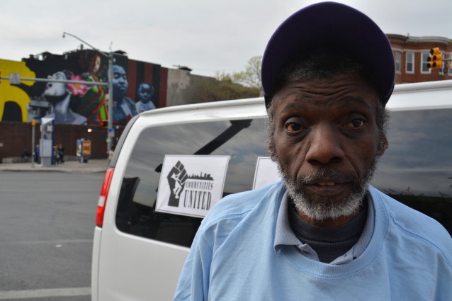 Reggie Smith waits to get a ride to the polls, where he will cast a ballot for the first time since the 1990s. CREDIT: Kira Lerner