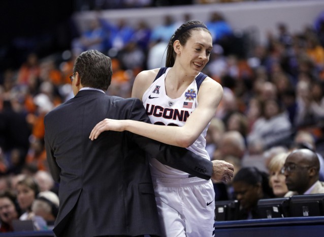 Connecticut’s Breanna Stewart (30) is greeted by head coach Geno Auriemma. CREDIT: Al Mast, AP
