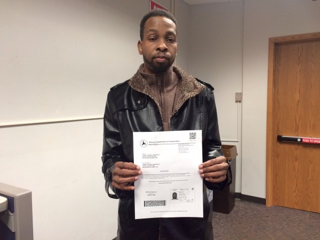 Milwaukee resident Ernest Barksdale shows the temporary ID he got from the DMV that he will use to vote in the presidential primary. CREDIT: Alice Ollstein