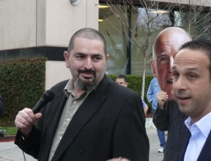 Gabriel Khanlian, left, listens to Councilman Mitch Englander outside an AQMD hearing in January. CREDIT: Samantha Page/ThinkProgress