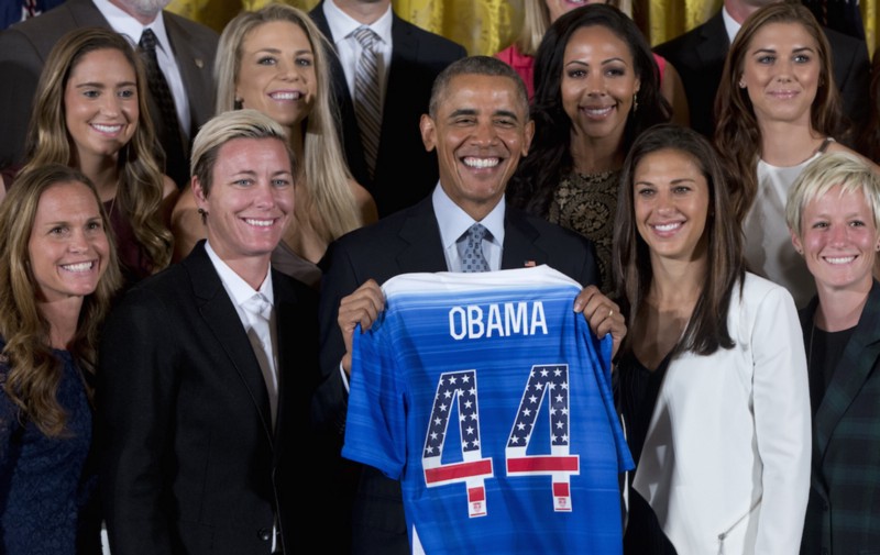 Members of the U.S. Women’s National Soccer Team with President Obama after their victory in the 2015 Women’s World Cup CREDIT: AP PHOTO/CAROLYN KASTER