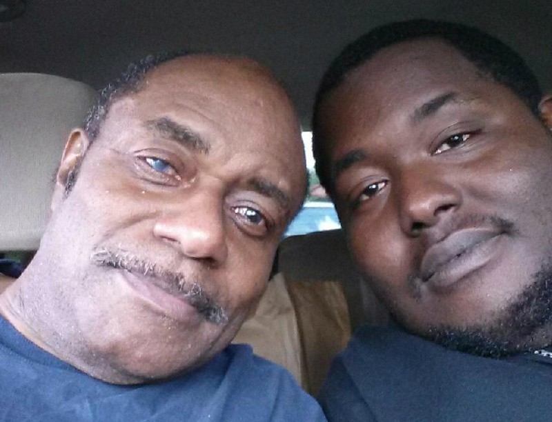 Eddie Robsinson, left, with his son on the day he was released last July. His right eye is visibly clouded with glaucoma. CREDIT: EDDIE ROBINSON