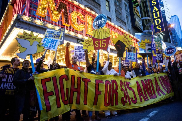 Protestors pause near a McDonald’s restaurant in Times Square during a rally and march in New York, Wednesday, April 15, 2015 CREDIT: AP Photo/Craig Ruttle