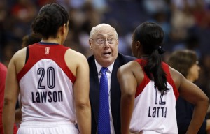 Washington Mystics head coach Mike Thibault talks with guards Kara Lawson (20) and Ivory Latta (12) on Sunday, June 28, 2015 in Washington. CREDIT: Alex Brandon, AP