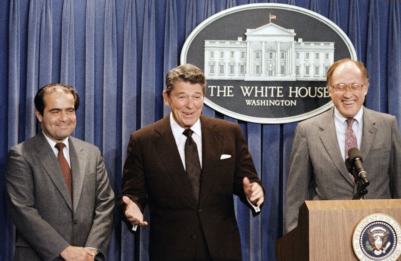 President Ronald Reagan announces the nomination of Judge Antonin Scalia to the Supreme Court in 1986, with conservative future Chief Justice William Rehnquist to his right. CREDIT: AP PHOTO/RON EDMONDS