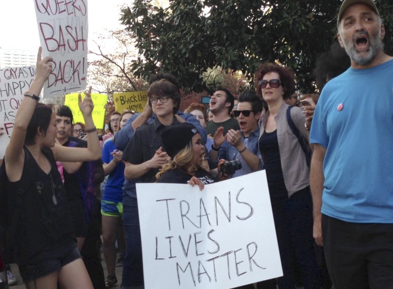 FILE- In this March 24, 2016, file photo, people protest outside the North Carolina Executive Mansion in Raleigh, N.C. A South Carolina proposal to forbid transgender people from using restrooms that correspond to their gender identity is part of a backlash by lawmakers across the historically conservative South. North Carolina passed a law that bans cities and counties from passing anti-discrimination ordinances. CREDIT: AP PHOTO/EMERY P. DALESIO