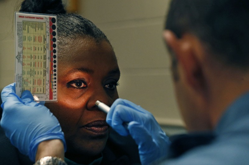 Colorado Department of Transportation official Robin Rocke, left, trains a state trooper in how to conduct field sobriety tests for marijuana intoxication. CREDIT: AP PHOTO/BRENNAN LINSLEY