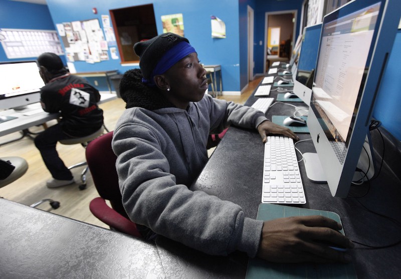 Jovontae Sisco, 22, uses a computer at the Ruth Ellis Center, a drop-in shelter for LGBT — lesbian, gay, bisexual or transgender youth in Detroit, Friday, March 2, 2012. CREDIT: PAUL SANCYA, AP