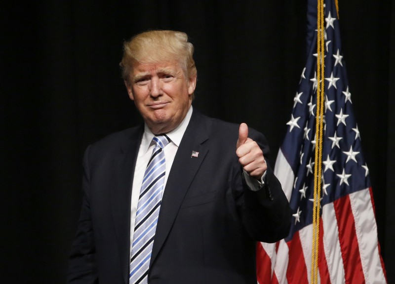 Republican presidential candidate Donald Trump acknowledges the crowd after giving an energy speech at the Williston Basin Petroleum Conference, Thursday, May 26, 2016, in Bismarck, N.D. CREDIT: AP PHOTO/CHARLES REX ARBOGAST