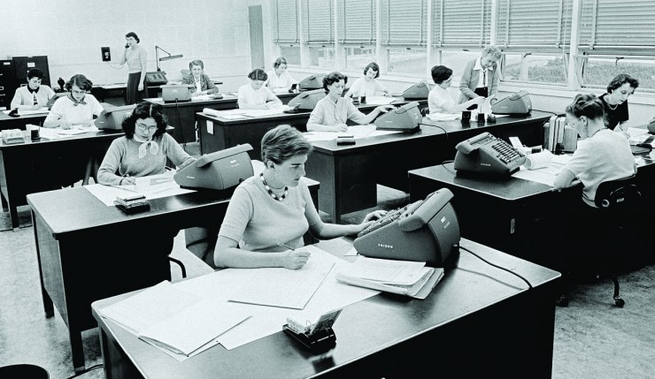 The computers at work, 1955. Helen Ling is sitting at the second desk, left side. Barbara Lewis (Paulson) is on the phone at the back, and Macie Roberts is standing on the right side near the window. CREDIT: Courtesy NASA/JPL-Caltech