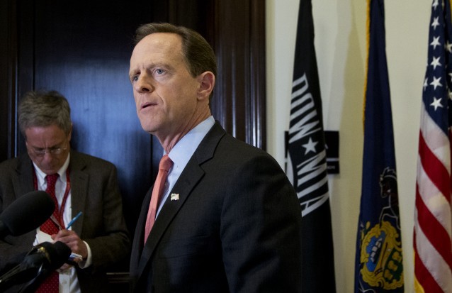 Sen. Patrick J. Toomey (R-PA) speaks to reporters outside his office on Capitol Hill, in Washington, Tuesday, April 12, 2016. CREDIT: AP Photo/Manuel Balce Ceneta