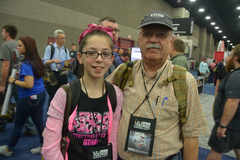 Twelve-year-old Ciara Palermo and her dad, Tom, at the NRA’s annual meeting. CREDIT: KIRA LERNER