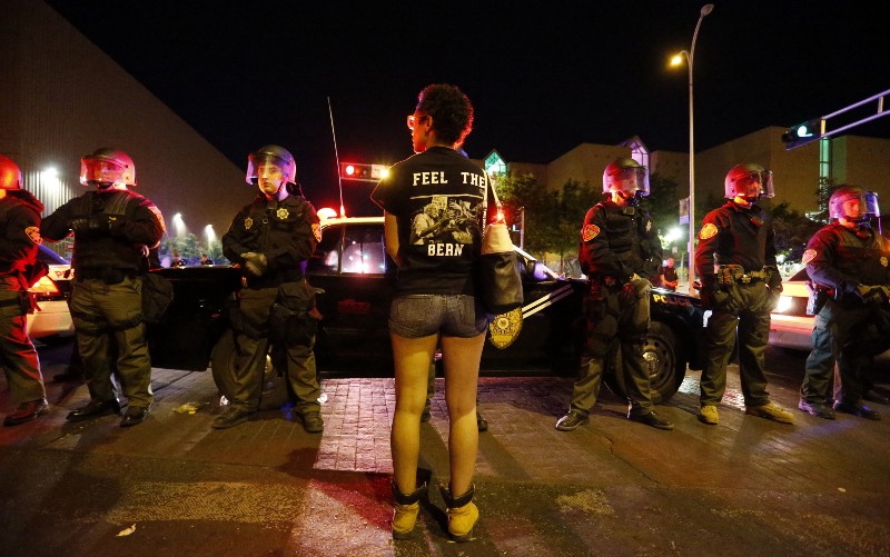Riot police block off the Albuquerque Convention Center to anti-Trump protests following a rally and speech by Republican presidential candidate Donald Trump at the convention center where the event was held, in Albuquerque, N.M., Tuesday, May 24, 2016. CREDIT: AP PHOTO/BRENNAN LINSLEY