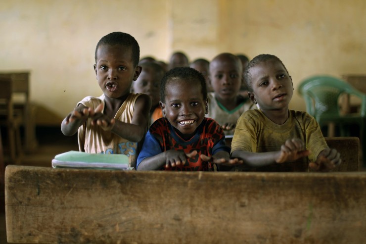 Somali children smile as they sing during class at the Illeys primary school in Dagahaley refugee camp north of Dadaab, Eastern Kenya, 100 kms (60 miles) from the Somali border, Thursday Aug. 11, 2011. CREDIT: AP Photo/Jerome Delay