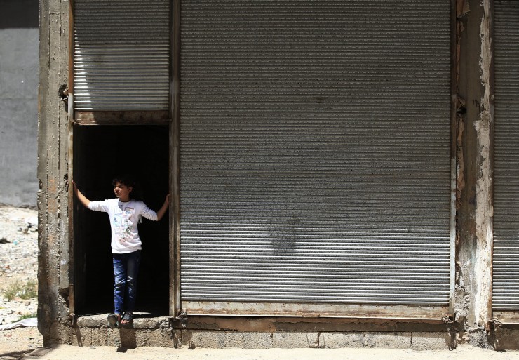 A Syrian refugee child stands outside a commercial space that her family has rented to live in, in a neighborhood of the city of Gaziantep, southeastern Turkey, Monday, May 16, 2016. Turkey has taken in some 3 million refugees including approximately 2.7 million Syrians making it the country with the world’s largest refugee population. (AP Photo/Lefteris Pitarakis) CREDIT: AP Photo/Lefteris Pitarakis
