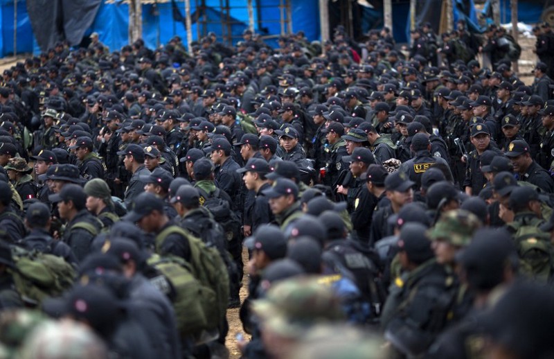 Hundreds of police officers gather for the second day of an operation to eradicate illegal mining in the area known as La Pampa, in Peru’s Madre de Dios region in Aug. 2015.