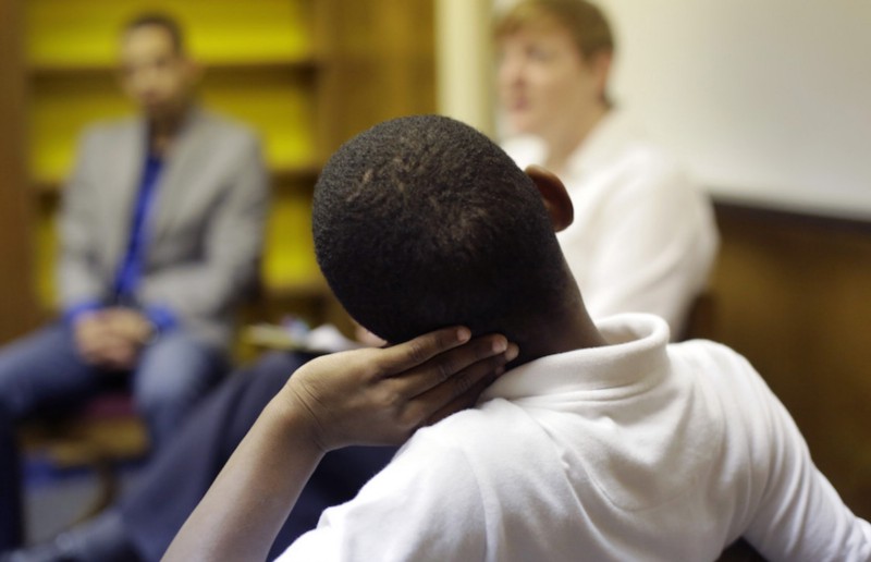 Seventh-grader Jayden Witter, foreground, discusses a recent conflict with another student solved through restorative justice, which included teachers and students gathering in circles for discussions, at Ed White Middle School, Friday, Oct. 16, 2015, in San Antonio. CREDIT: ERIC GAY, AP