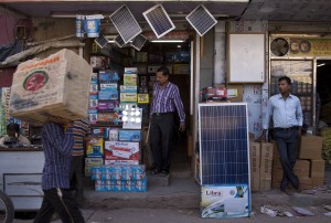 In this Oct. 1, 2015 photo, solar panels are displayed for sale at a market in New Delhi, India. India plans a fivefold boost in renewable energy capacity in the next five years to 175 gigawatts, including solar power, wind, biomass and small hydropower dams. CREDIT: AP Photo/Saurabh Das