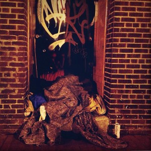 A person tucked away in an alley by the Howard Theater CREDIT: Thinkprogress/alejandro davila fragoso