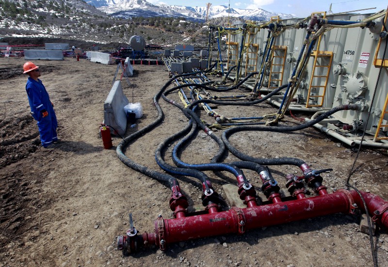 In this March 29, 2013, file photo, a worker helps monitor water pumping pressure and temperature, at a hydraulic fracturing and extraction site, outside Rifle, in western Colorado. The Colorado Supreme Court has struck down attempts by two cities to ban or delay fracking. The Monday, May 2, 2016, ruling is a victory for the oil and gas industry and for state officials who say only state government can regulate energy, not cities or counties. CREDIT: AP PHOTO/BRENNAN LINSLEY