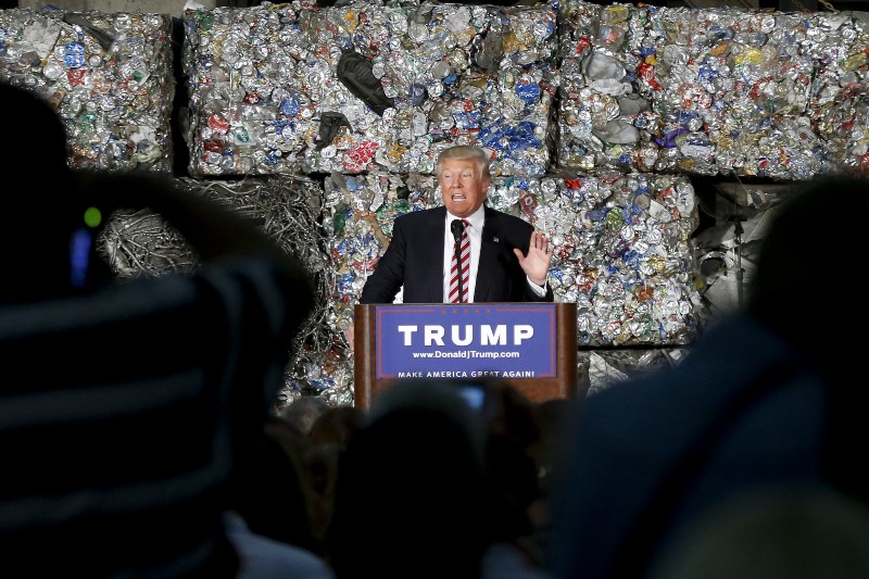 Donald Trump speaks in front of a pile of garbage. CREDIT: KEITH SRAKOCIC (AP)