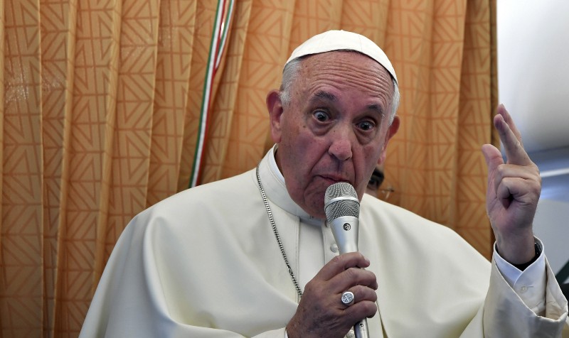 Pope Francis talks to journalists during a press conference he held on board the airplane on his way back to the Vatican, at the end of three-day visit to Armenia, Sunday, June 26, 2016. CREDIT: TIZIANA FABI/POOL PHOTO VIA AP